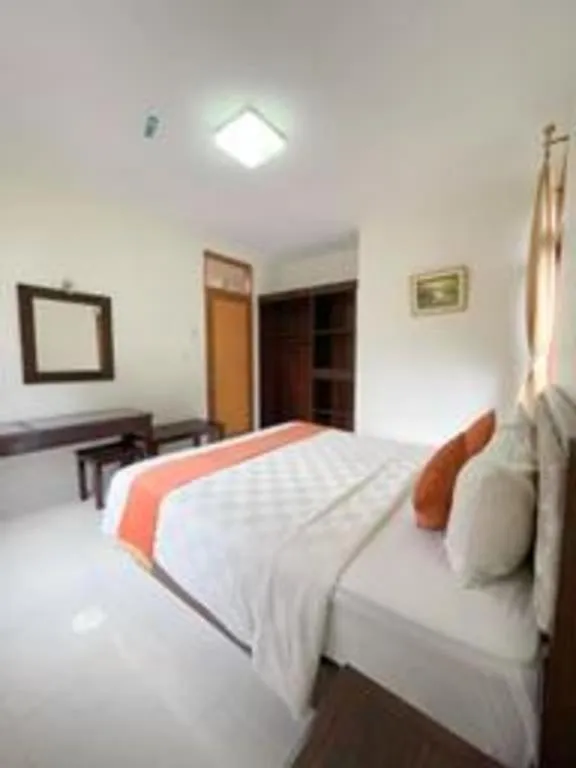 Bed in Ole Suite Hotel and Cottage