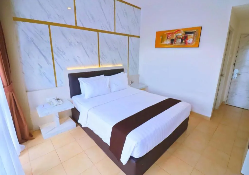 Bed in Grand Malioboro Yogyakarta