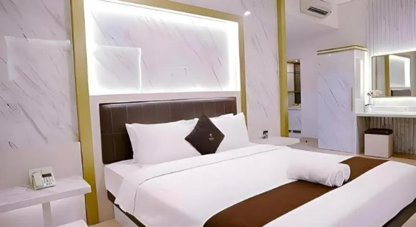 Bed in Grand Malioboro Yogyakarta