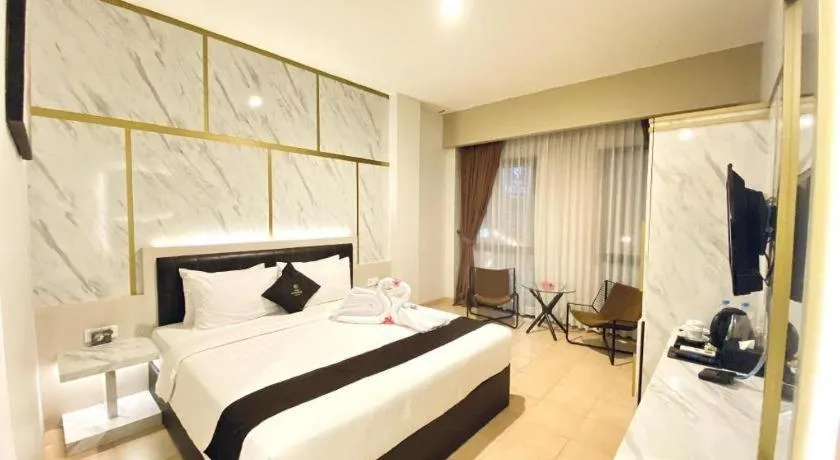 Bed in Grand Malioboro Yogyakarta