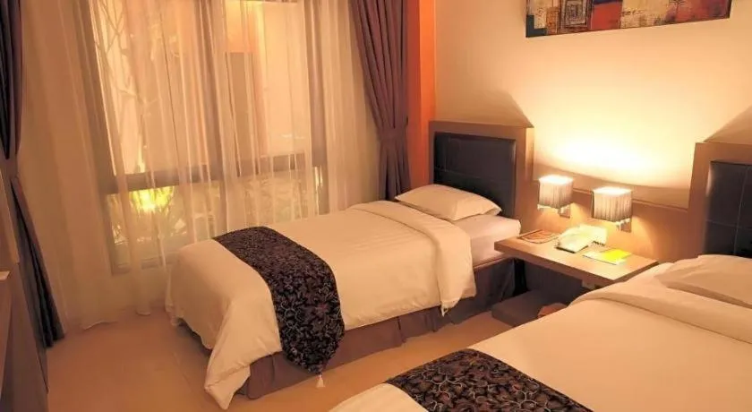 Bed in Grand Malioboro Yogyakarta