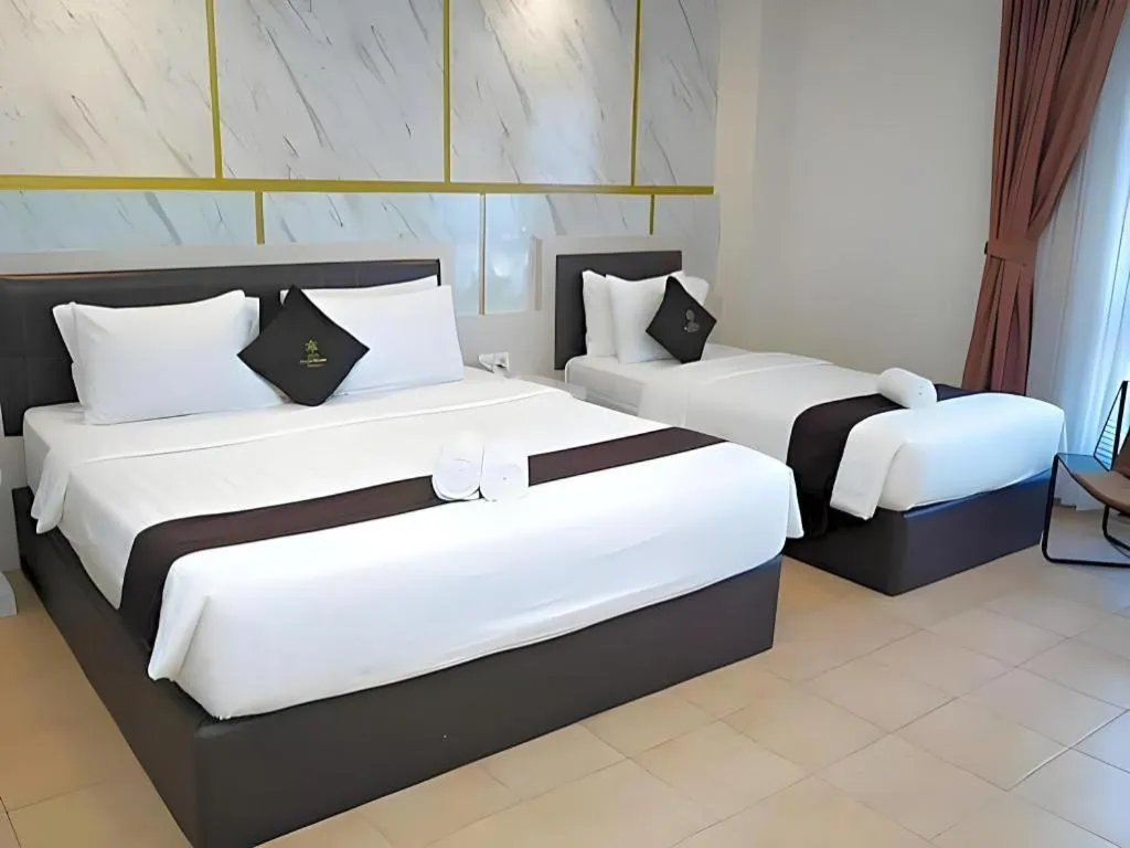 Bed in Grand Malioboro Yogyakarta