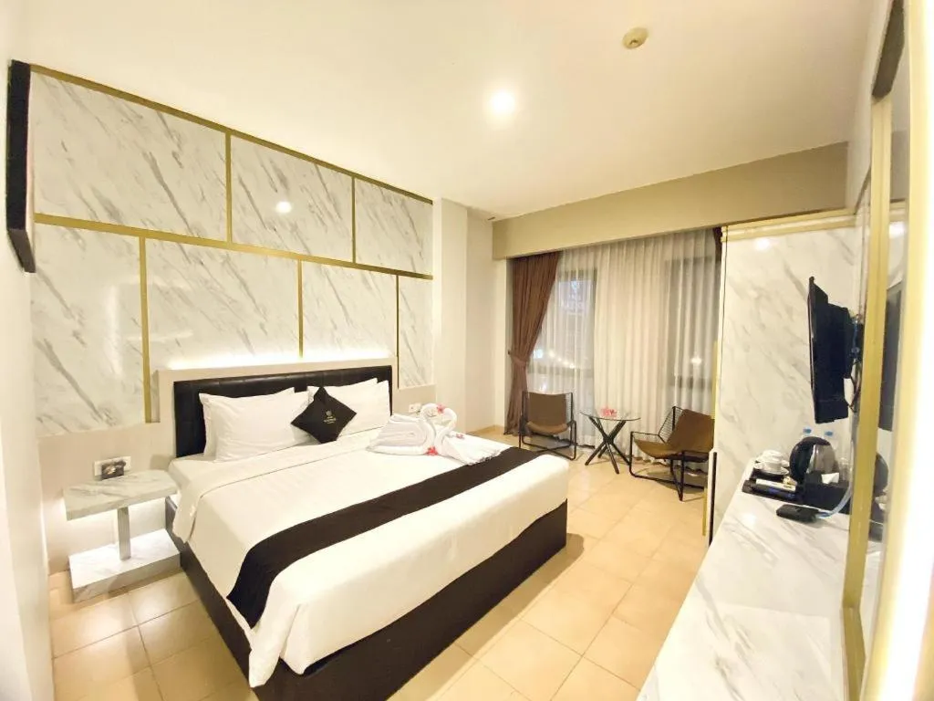 Bed in Grand Malioboro Yogyakarta