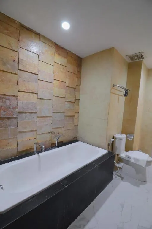 Bed in Grand Malioboro Yogyakarta