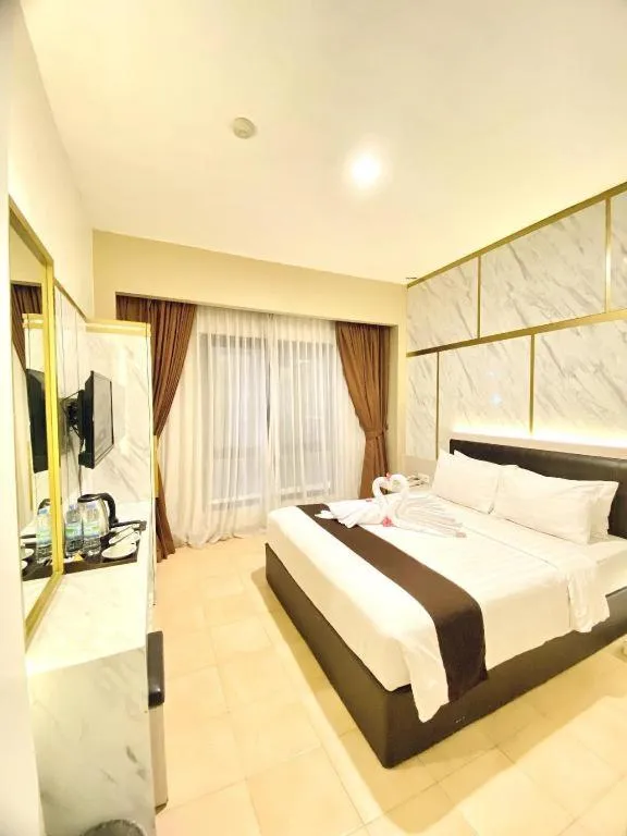 Bed in Grand Malioboro Yogyakarta