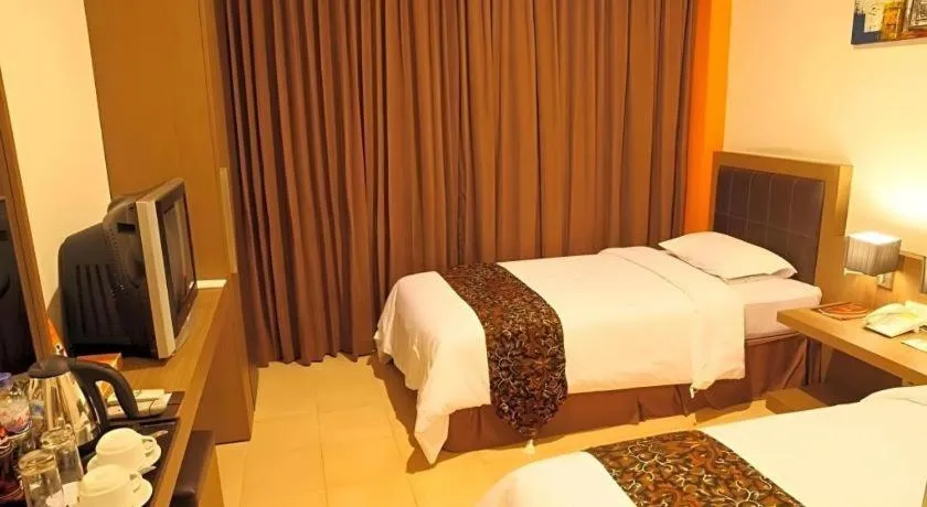 Bed in Grand Malioboro Yogyakarta