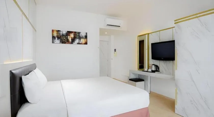 Bed in Grand Malioboro Yogyakarta