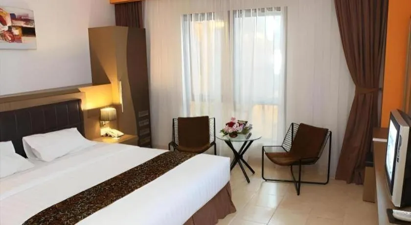 Bed in Grand Malioboro Yogyakarta