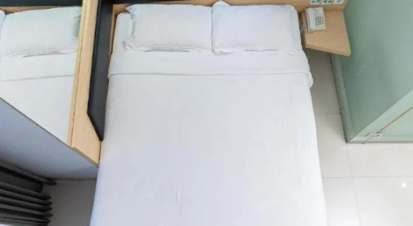 Bed in G Suites Hotel By AMITHYA