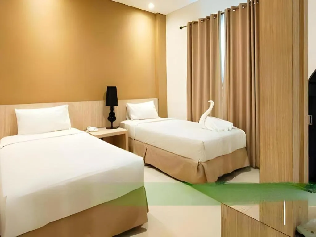 Bed in HW Hotel Padang