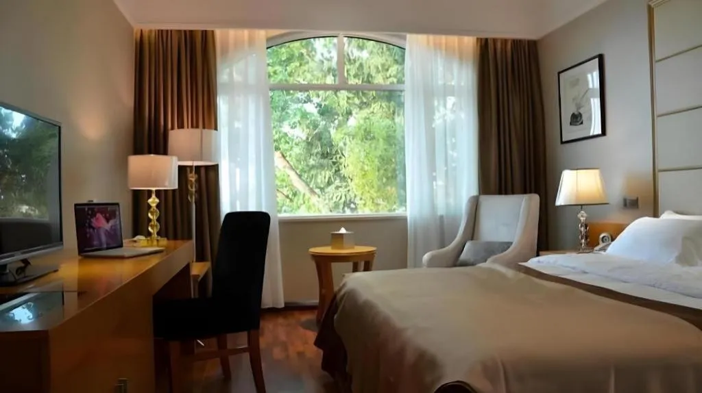 Bed in San Jiang Grand Hotel