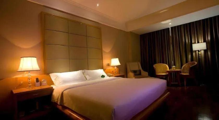 Bed in San Jiang Grand Hotel