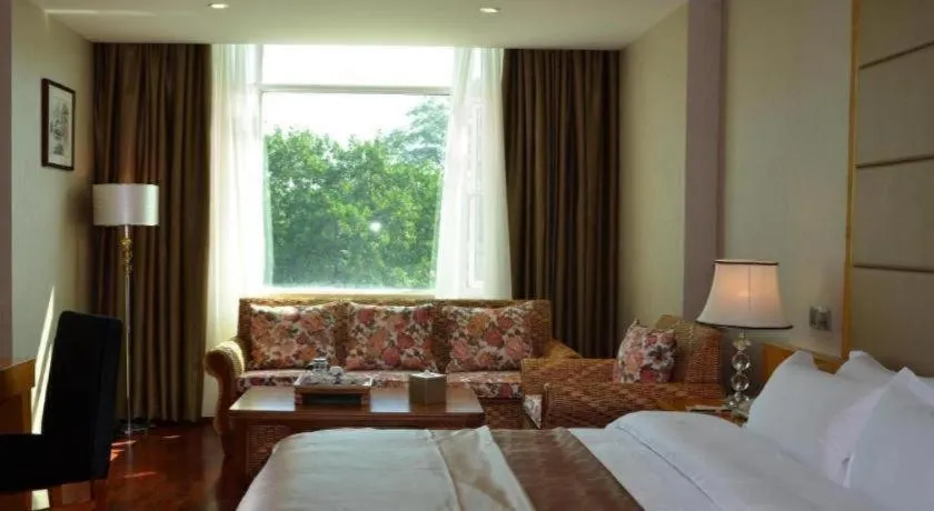 Bed in San Jiang Grand Hotel