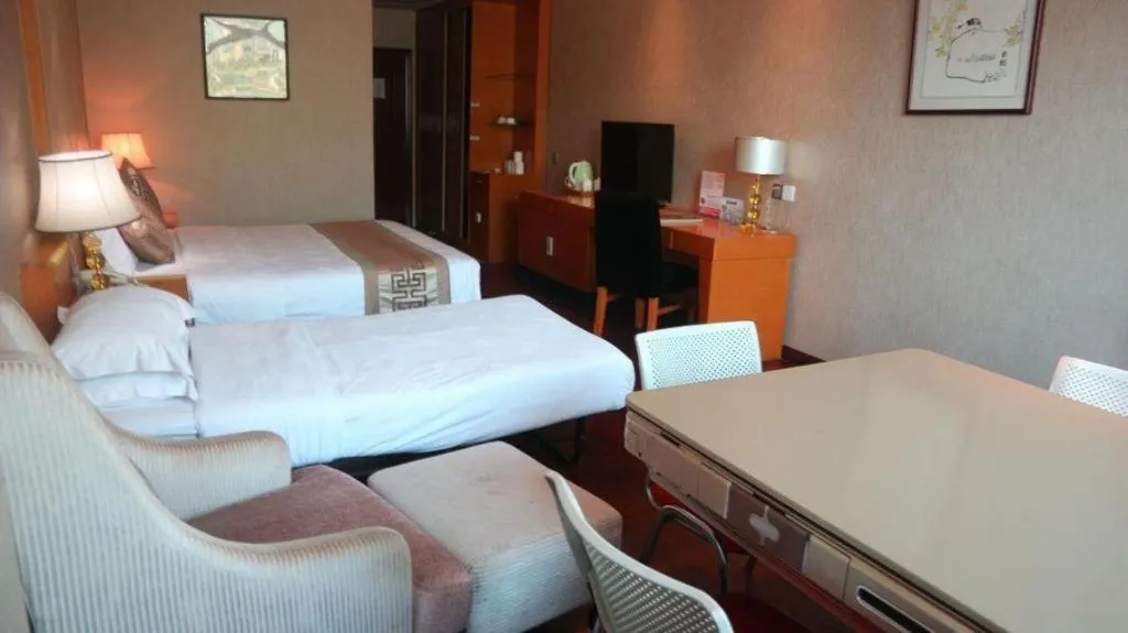 Bed in San Jiang Grand Hotel