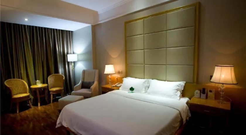 Bed in San Jiang Grand Hotel