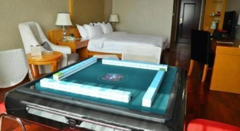 Bed in San Jiang Grand Hotel