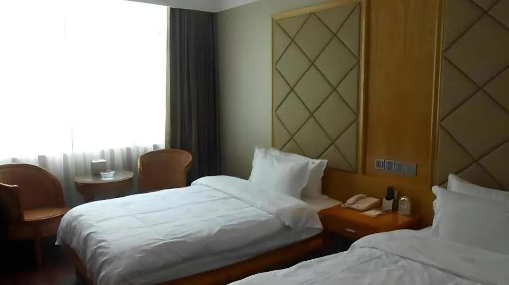 Bed in San Jiang Grand Hotel