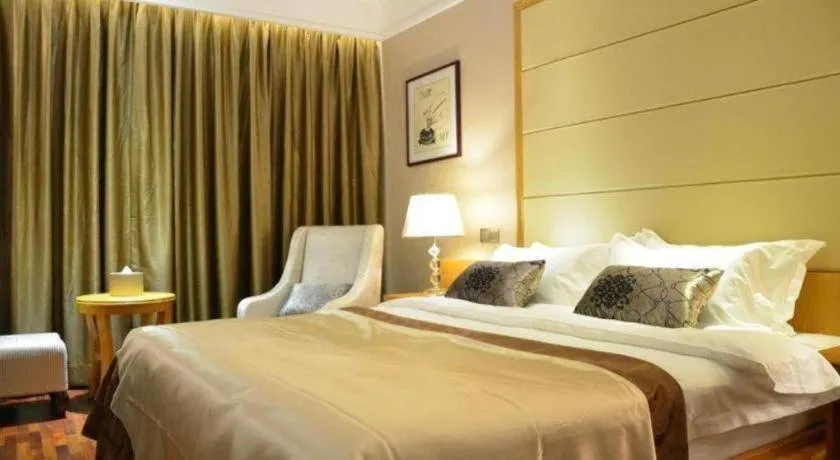 Bed in San Jiang Grand Hotel