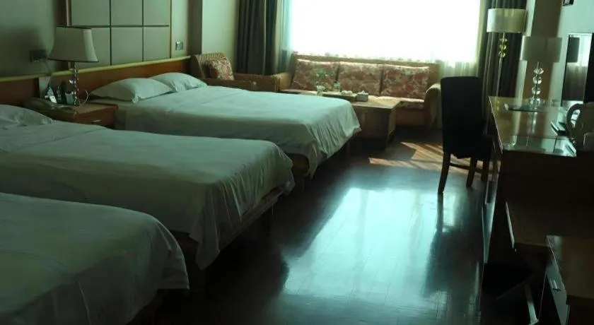 Bed in San Jiang Grand Hotel