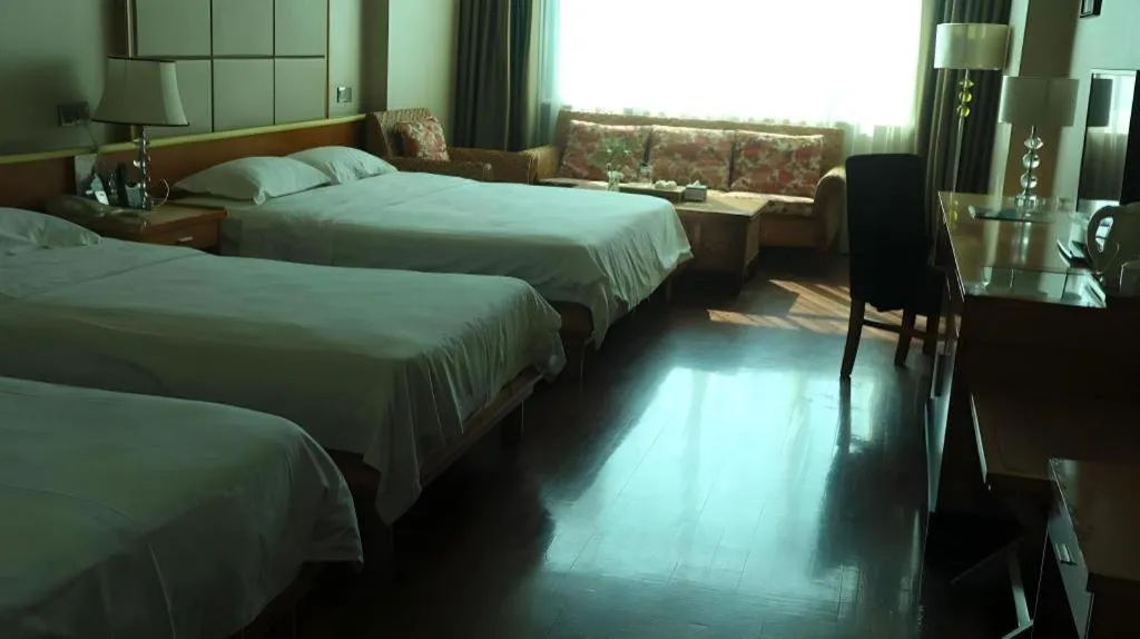 Bed in San Jiang Grand Hotel