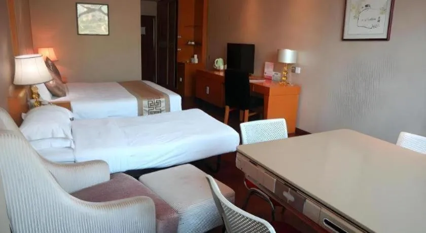 Bed in San Jiang Grand Hotel