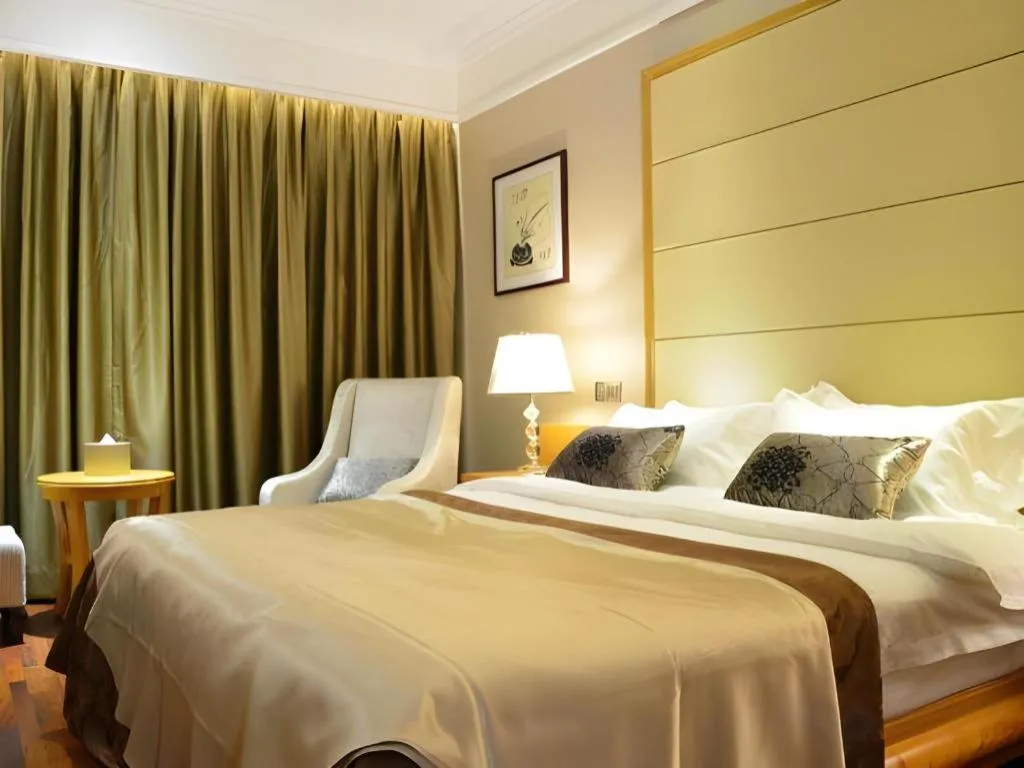 Bed in San Jiang Grand Hotel