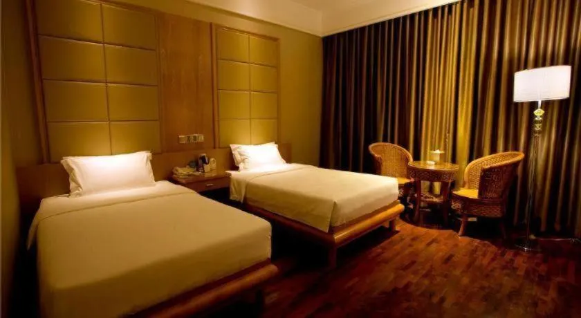 Bed in San Jiang Grand Hotel