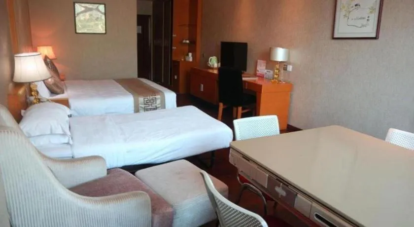 Bed in San Jiang Grand Hotel