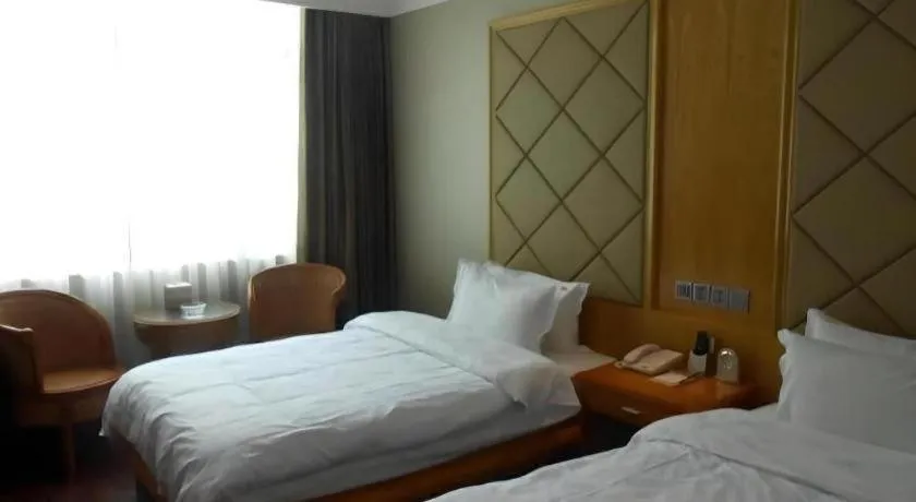 Bed in San Jiang Grand Hotel