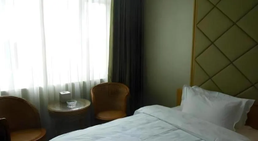 Bed in San Jiang Grand Hotel