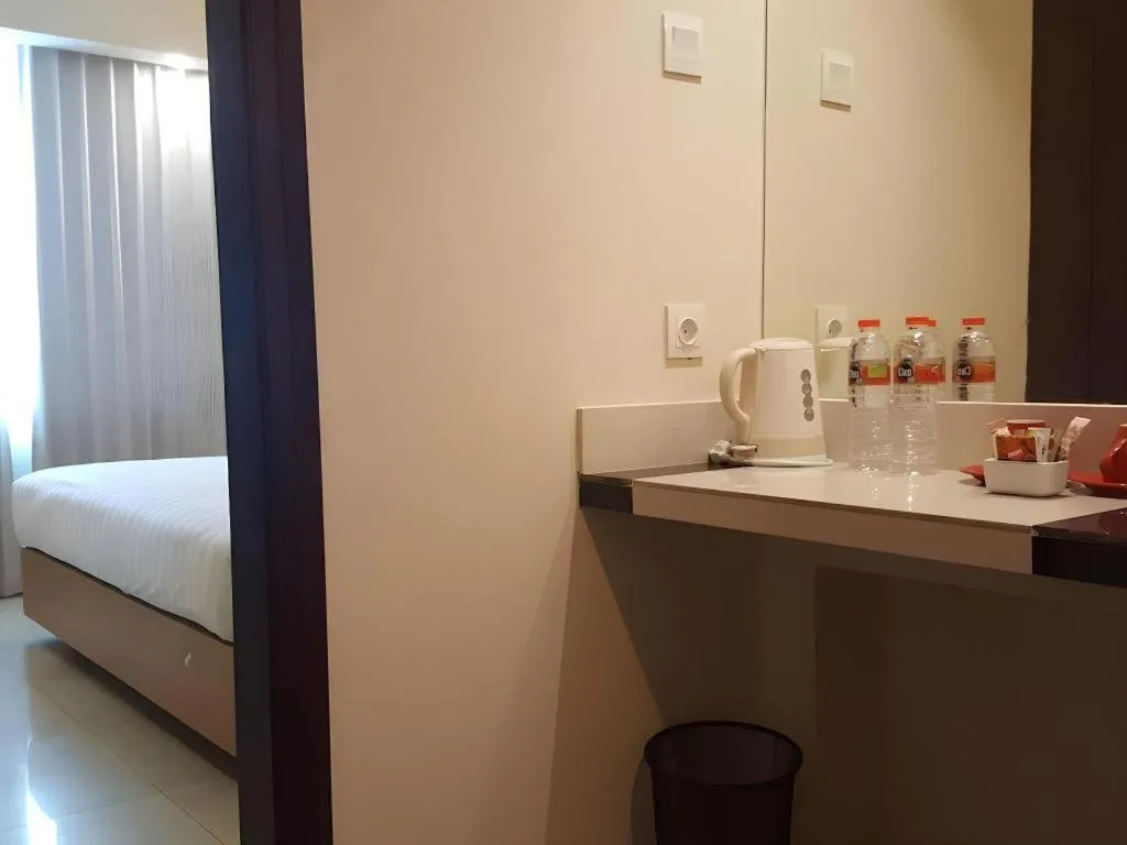 Bed in Kharisma Hotel