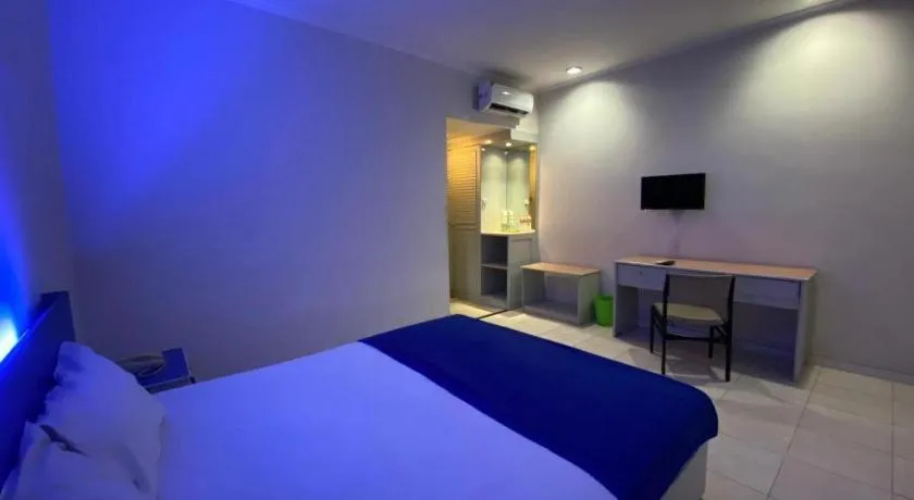 Bed in Kharisma Hotel