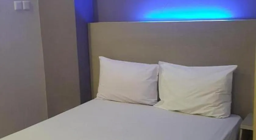 Bed in Kharisma Hotel