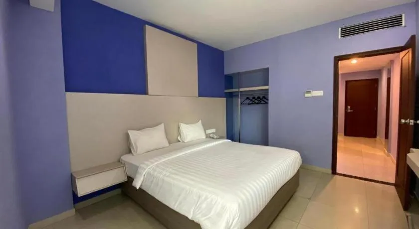 Bed in Kharisma Hotel