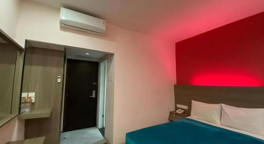 Bed in Kharisma Hotel