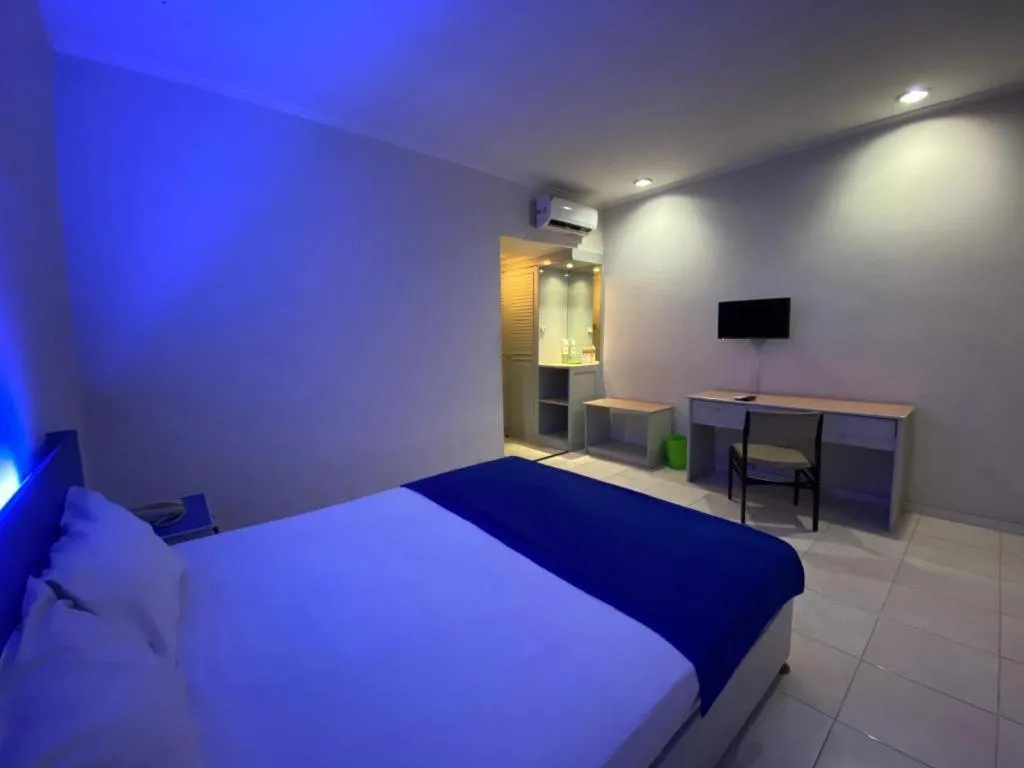 Bed in Kharisma Hotel