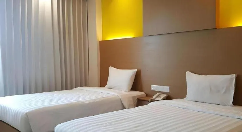 Bed in Kharisma Hotel