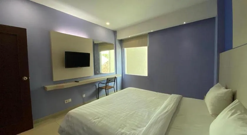 Bed in Kharisma Hotel