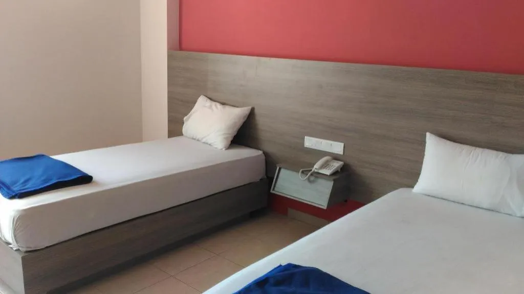 Bed in Kharisma Hotel