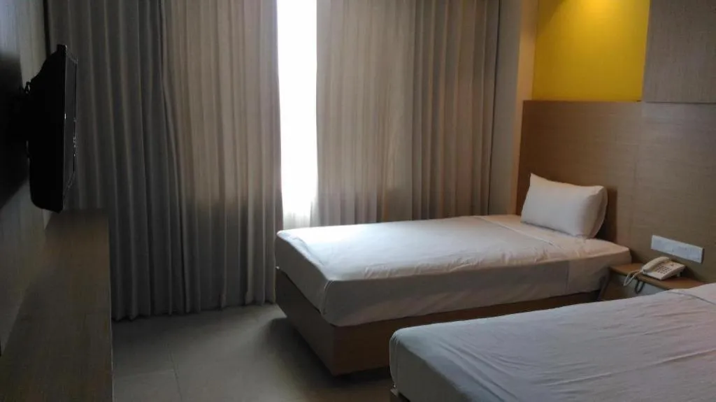 Bed in Kharisma Hotel