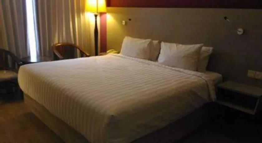 Bed in Kharisma Hotel
