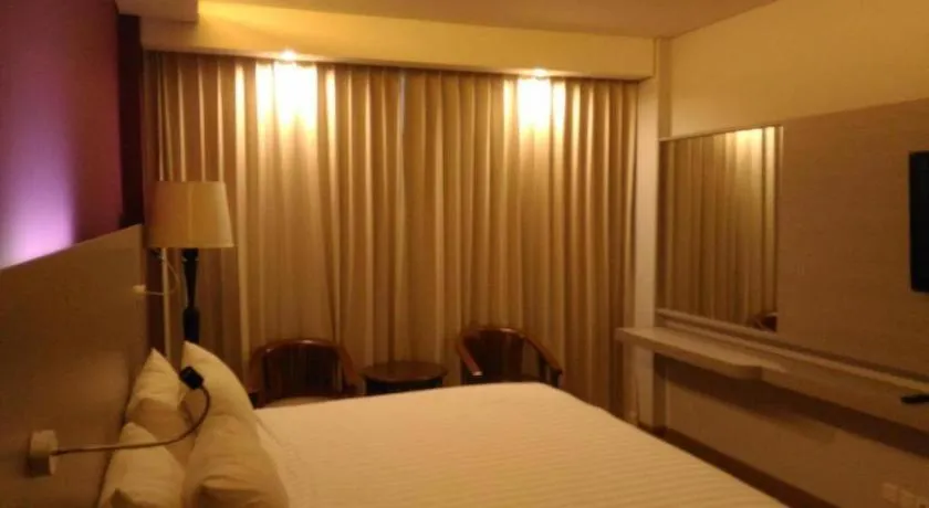 Bed in Kharisma Hotel