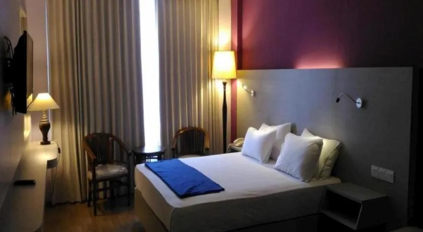 Bed in Kharisma Hotel