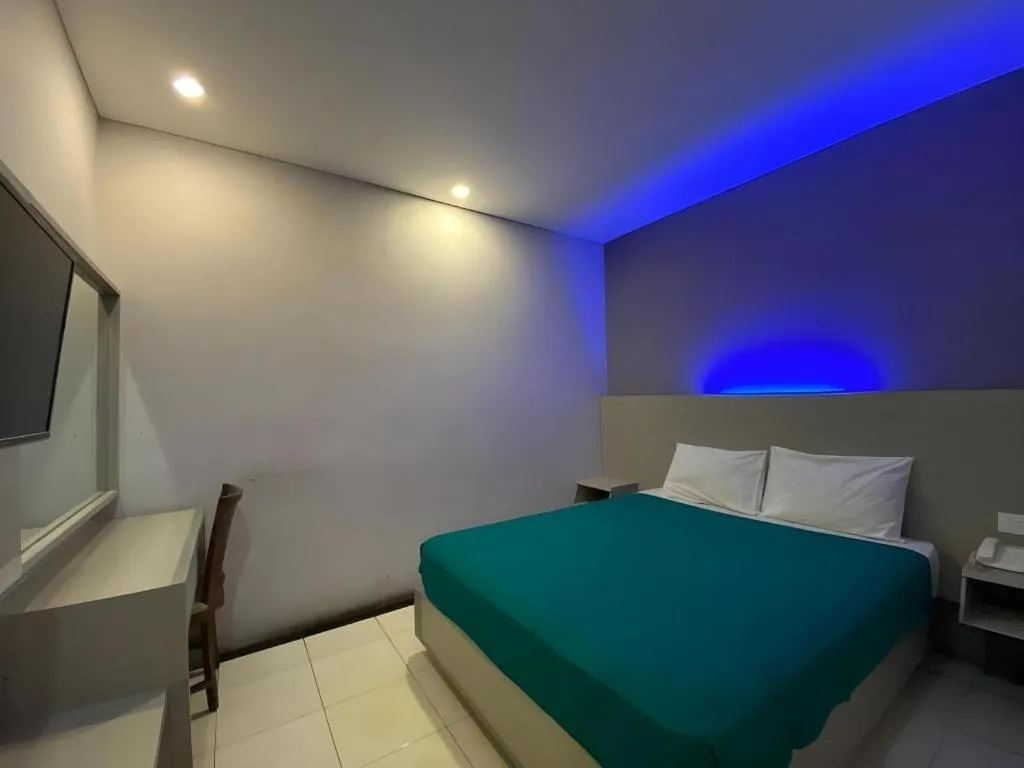 Bed in Kharisma Hotel