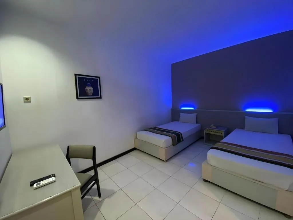 Bed in Kharisma Hotel