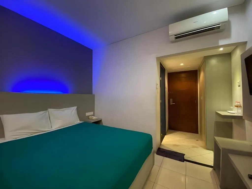 Bed in Kharisma Hotel