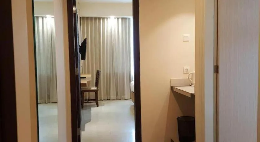 Bed in Kharisma Hotel