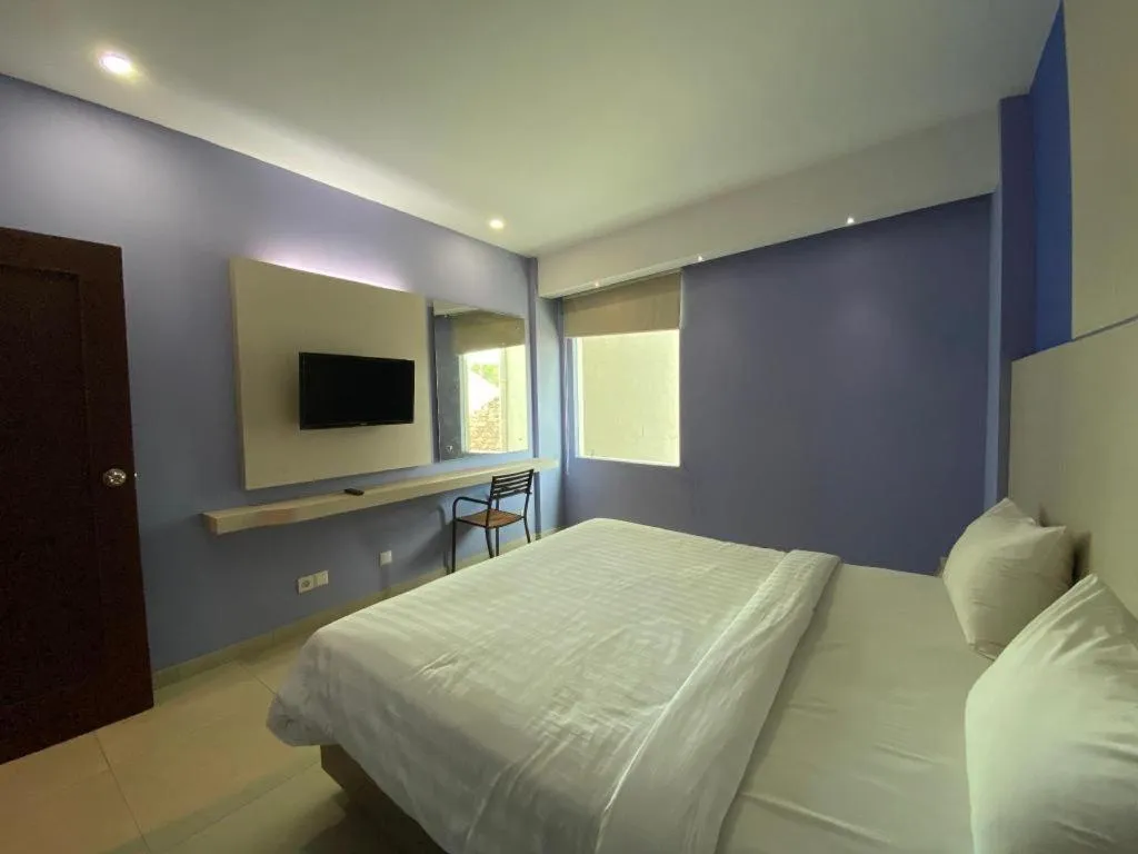 Bed in Kharisma Hotel