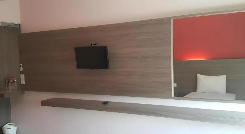 Bed in Kharisma Hotel