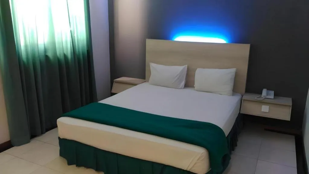 Bed in Kharisma Hotel